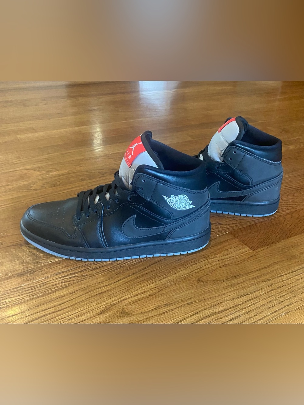 Jordan Black Mid-Top Sneakers with Red Tongue Accent